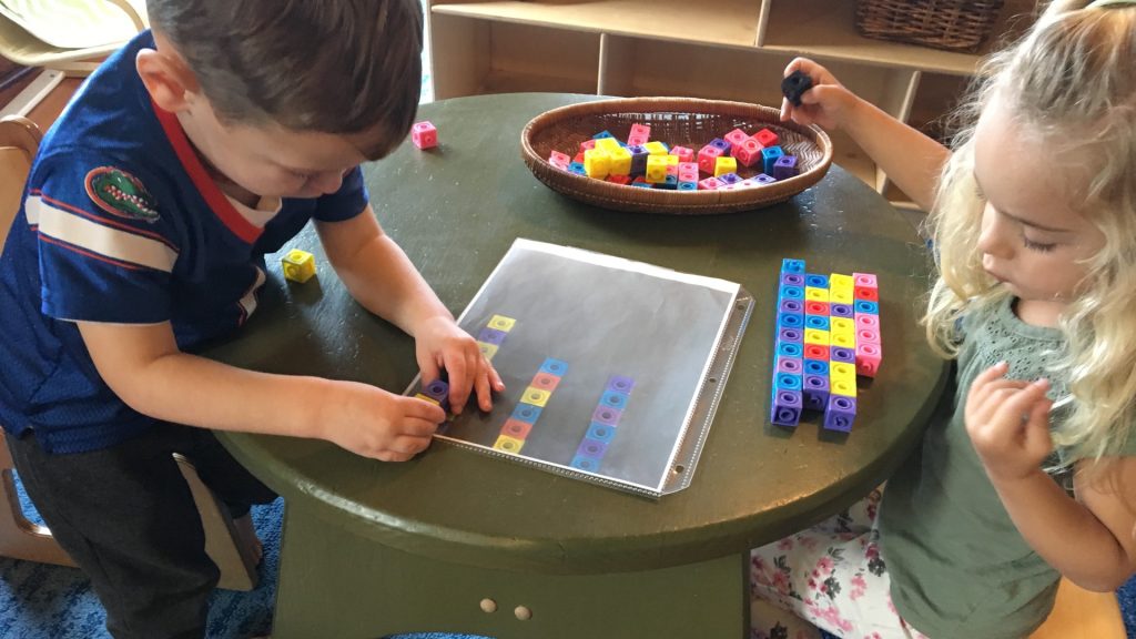 two kids playing with blocks at sumner valley preschool in sumner wa